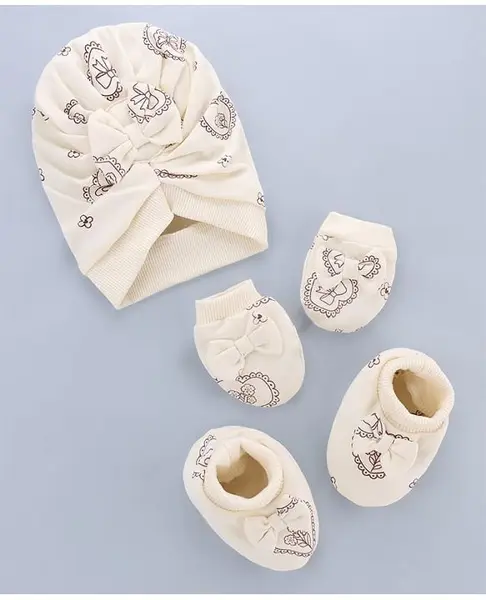 Babyoye 100% Cotton Interlock Knit With Eco Jiva Finish Cap Mitten & Booties Set With Heart & Bow Print Beige - Diameter 14 cm