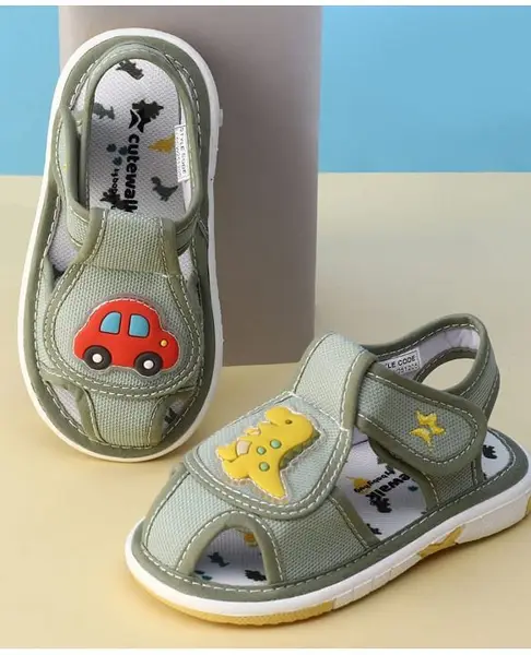 Cute Walk by Babyhug Velcro Closure Printed Musical Sandal With Vehicles & Dino Applique - Olive Green